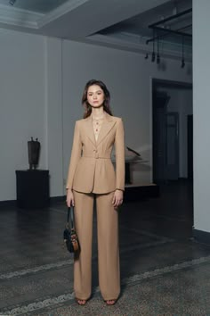 Fitted Winter Formal Pantsuit, Winter Formal Fitted Pantsuit, Luxury Long Sleeve Fall Pantsuit, Luxury Long Sleeve Pantsuit For Fall, Structured Evening Pantsuit For Fall, Luxury Evening Pantsuit For Fall, Elegant Fall Semi-formal Pantsuit, Single Breasted Pantsuit For Formal Winter Occasions, Chic Formal Pantsuit For Winter