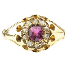 A classic and timeless antique cluster ring is a perfect gifting or engagement ring choice. This gorgeous Edwardian era cluster ring is one of those elegant beauties, it features a lovely pinky red ruby which is surrounded by a halo of rose cut diamonds. All set into rich 18ct yellow gold with chunky shoulders and a slender tapering gold band and a belcher style setting. Looks great stacked with a nice gold band or worn alone. Marks and era: Edwardian era, fully hallmarked for 18ct gold, Birmingham assay office, Date letter rubbed c1900s. Condition: Good used condition overall, minor surface wear, commensurate with age, some light surface wear to the stone, thinning to the back of the band from wear. Ring face Approx 8.9mm length and 1.5mm band width. Central Ruby approx 0.30ct weight, est Classic Pink Cluster Ring For Formal Occasions, Classic Ruby Ring With Rose Cut Diamond Cluster, Classic Pink Cluster Ring With Center Stone, Victorian Gemstone Cluster Wedding Ring, Victorian Gemstone Cluster Ring For Wedding, Elegant Pink Cluster Ring With Rose Cut Diamonds, Elegant Pink Rose Cut Diamond Cluster Ring, Vintage Pink Diamond Ring Hallmarked, Vintage Pink Diamond Ring With Hallmark