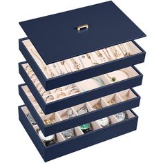 three blue boxes filled with jewelry on top of each other