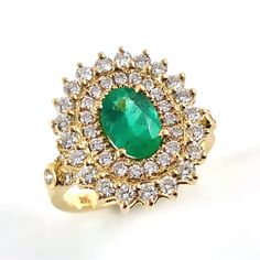 Emerald oval and diamond yellow gold ring Size 7.5 US - Ready to ship or Resize This is Emerald oval brilliant cut 0.97 carat gemstone measuring approximately 8.22x5.75x3.56mm flanked by a multitude of diamonds and set in 14k yellow gold ring. I provide a layaway payment plan just ask me. Ring Specifications: * 0.97 carat Emerald, oval cut * 54 Melee sized diamonds totalling 1.38 carats (31 x 1.5mm diamonds and 23 x 2mm diamonds). VS clarity, G-H color. * 14k yellow gold set ring * Ring size 7.5 Oval Yellow Gold Halo Ring Gia Certified, Luxury Oval Cluster Ring Stamped 14k, Luxury Stamped 14k Oval Cluster Ring, Yellow Gold Diamond Ring With Oval Cabochon, Timeless Yellow Gold Oval Halo Ring, Oval Emerald Ring In Yellow Gold With Halo Setting, Gia Certified Oval Diamond Ring In 14k Gold, Oval Yellow Gold Diamond Halo Ring, Gia Certified Oval Emerald Ring In Yellow Gold