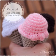 two crocheted ice cream cones are in the palm of someone's hand