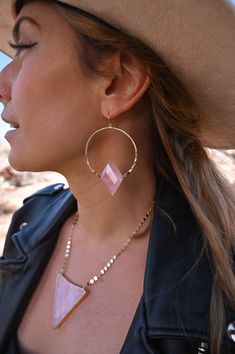 These stunning Rose Quartz gold hoop earrings are the perfect accessory for any outfit, and remind you to love yourself first every single day! They're versatile, and can be dressed up or down depending on the occasion. They are perfect for wearing to work, on a date, or to a special event. The soft pink hue of the rose quartz adds femininity and elegance, while the gold adds a touch of sophistication. Rose quartz is known for its calming and soothing energy, making these earrings not only beaut Rose Gold Quartz, Rose Quartz Earrings, Love Yourself First, Mala Necklace, Love Rose, Every Single Day, Quartz Earrings, Quartz Pendant, Love Yourself