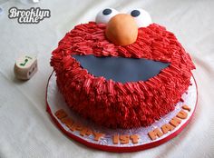 a birthday cake with an elmo face on it