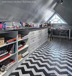 a room with black and white chevron flooring