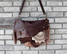 This bohemian bag is made of genuine  leather in dark brown. I use fringe details And you can pull out the fringe because they are attached with snap buttons.  The crochet is handmade. Large size. Closure is zipper. There are 1 zippered pocket inside and lined cotton fabric. Its  inner width is 37 and height is 27 cm. Thickness is 7 cm. (14.5'' x10.7'' x 2.8'' ) Strap is adjustable. Please note that color may vary according to monitor color calibrations. If you have any question, please don't he Boho Bag Crochet, Large Crossbody Bag, Bohemian Bag, Brown Crochet, Large Crossbody Bags, Bohemian Bags, Jeans Bag, Metal Accessories, Bag Crochet