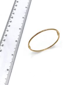 14K Yellow Gold Plain Baby Bangle. Fine Jewelry Yellow Gold Oval Bangle, Adjustable Yellow Gold Round Cuff Bracelet, Classic Adjustable Hoop Bracelets, Yellow Gold Flexible Bangle Bracelet, Flexible Yellow Gold Bangle Bracelets, Adjustable Hoop Yellow Gold Bracelet, Adjustable Yellow Gold Hoop Bracelet, Elegant Stackable Round Name Bracelet, 14k Gold Hinged Bracelets As Gift