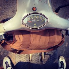 the back end of a scooter with a speedometer on it's seat