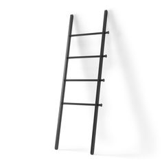 a ladder leaning up against a white wall