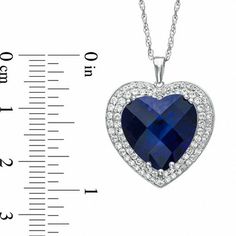 A timeless treasure, this glistening heart pendant is certain to win hers. Fashioned in sterling silver, the eye catches the 14.0mm heart-shaped lab-created blue sapphire center stone. A double border of shimmering round lab-created white sapphires wraps this center stone in a sparkling embrace. Polished to a brilliant shine, this heart suspends close to hers along an 18.0-inch box chain that secures with a spring-ring clasp. Sapphire Heart Pendant Jewelry For Anniversary, Sapphire Heart Cut Birthstone Jewelry, Heart-shaped Sapphire Jewelry For Formal Occasions, Heart Cut Sapphire Birthstone Jewelry, Sapphire Heart Cut Gemstone Jewelry, Formal Heart-shaped Sapphire Jewelry, Formal Sapphire Heart Necklace, Sapphire Heart Pendant With Heart Charm, Sapphire Heart Pendant Birthstone Jewelry