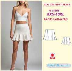 a woman wearing a white skirt and crop top with the text, mini trumpet skirt xxs - 10xl