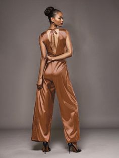 This soft satin jumpsuit features a flattering v-neck design, making it the perfect choice for mothers of the bride. Its dress pantsuit style provides comfort and elegance, while its high-quality material ensures a polished look. Stay stylish and comfortable on that special day with our jumpsuit. Chic Satin V-neck Jumpsuits And Rompers, Chic Satin Jumpsuits And Rompers In Solid Color, Chic Solid Color Satin Jumpsuits And Rompers, Solid Satin Jumpsuits And Rompers For Night Out, Elegant Satin Jumpsuits And Rompers For Workwear, Elegant Satin Jumpsuit Or Romper In Solid Color, Sleeveless Satin Jumpsuits And Rompers, Sleeveless Satin Jumpsuit Or Romper, Chic Satin Jumpsuits And Rompers With V-neck