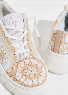 So bohemian-inspired and seriously unique, these effortlessly cool sneakers are featured in a lace-up style and low-top silhouette with a hand crocheted upper, woven floral details, and a chunky lug sole. Lace-up style Hand crocheted Durable rubber outsole Please Note: This style is hand crocheted and one-of-a-kind, therefore what you receive may differ slightly from the photo. Sizing Note: If in between sizes, size up. Crochet Footwear, Cute Sofa, Zara 2022, Remake Clothes, Cool Sneakers, Diy Sneakers, Men's Shoes Accessories, Sweater Crochet