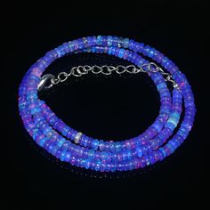 "OPAL NECKLACE'S| AAA++ Ethiopian Welo Opal|Purple Opal Beads Necklace|Opal Bead Stand| Welo Fire Opal| Multi Fire Opal Beads| Genuine Opal Gemstone Type : Opal Gemstone Item Code :   1192 Origin       -:     Ethiopia Grade       -:  AAA++ Stone shape-: Smooth Rondelle Beads Stone color-:Purple Opal Same As Picture Metal        -:     Brass Length     -: 16 Inch Quantity  -: 1 Strand Necklace Approx Weight   :  41.10 Carat Approx Size        :   4X4 MM 100% Genuine & Natural If you have any questions about this item please contact me I will get back to you as soon as If you want More Quantity in Any Necklace then you can get it in our company. ABOUT US skgemsstone based in Jaipur, India is a company engaged in supplier, manufacturing, wholesale and retail business of Gemstones ( semi preci Polished Round Bead Opal Necklaces, Polished Round Opal Bead Necklaces, Opal Necklaces With Polished Round Beads, Handmade Opal Bead Necklaces, Handmade Opal Necklaces With Round Beads, Beaded Opal Rondelle Necklaces, Opal Beaded Necklaces With Round Beads, Opal Gemstone Beaded Necklaces As Gift, Opal Gemstone Beaded Necklaces For Gift