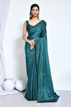 Teal Green satin silk stone work saree with blouse N8141A Get your hands on the newest collection of exquisite satin silk sarees adorned with intricate embroidery and stunning stone embellishments, all at budget-friendly prices. These sarees feature soft pastel tones and elegant floral designs, ensuring they remain stylish and timeless for years to come. Purchase these luxurious satin silk sarees exclusively at Kollybollyethnics. Desc:  Color : teal Green Fabric : satin silk  Work : stone&n Tussar Silk Saree With Unstitched Blouse For Reception, Silk Saree With Zari Weaving For Reception, Festive Satin Pre-draped Saree, Elegant Satin Pre-draped Saree With Pallu, Satin Pre-draped Saree For Reception, Semi-stitched Tussar Silk Saree For Reception, Tussar Silk Saree With Self Design For Reception, Banarasi Silk Saree For Reception And Eid, Banarasi Silk Saree For Reception During Eid