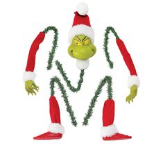 the grin face and arms are made out of fake christmas garlands with lights on them