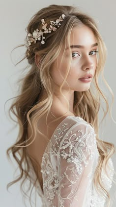 a woman with long blonde hair wearing a wedding dress