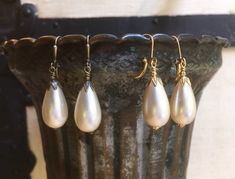 "This listing is for one pair of earrings. These were made using vintage Japanese acrylic pearl beads and gold-plated or antiqued brass findings and hinged lever-back earwires. These are nicely light-weight for their size. The pearl beads are \"vintage new\", and do tend to have some variations and minor flaws, but care is taken not only to match up beads in the pairs, but to make sure no seriously flawed beads are used. They measure just over 1 5/8\" (41mm) in length, including the earwires. No Vintage Teardrop Pearl Drop Earrings, Vintage Teardrop Pearl Earrings, Vintage Handmade Teardrop Pearl Earrings, Vintage Gold Teardrop Pearl Earrings, Teardrop Pearl Earrings, Pear Earrings, Earrings Etsy, Gold Plated Earrings, Vintage Japanese