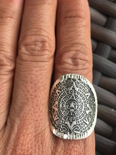 This is an adjustable Ring Made from 925 silver ( Sterling Silver) Sun Stone Ring / Aztec Calendar Ring Weight: 7.8 gr Diameter: 2.8 cm Aztec Rings, Serpentine Stone, Aztec Calendar, Sun Stone, Crystal Bags, Phone Purse, Adjustable Ring, Beautiful Bags, Stone Ring