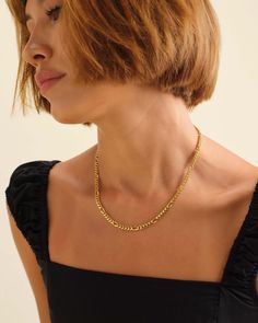 Introducing our exquisite women's gold 5mm Figaro chain, a true embodiment of elegance and sophistication. Meticulously crafted, this unique design showcases our renowned Cuban links, expertly spaced two links further apart than the traditional Figaro pattern. Elevate your style to new heights with this refined and timeless statement piece, exuding confidence and grace with every wear. JAXXON 5mm Women's Figaro Gold Chain | 18" Luxury Figaro Chain Necklace With Rectangular Links, Luxury Figaro Chain Necklace With Oval Links, Formal Cuban Link Necklace With Figaro Chain, Luxury Figaro Chain Link Necklace, Elegant Figaro Chain Link Necklace, Modern Cuban Link Necklace With Figaro Chain As Gift, Elegant Cuban Link Jewelry For Everyday, Elegant Everyday Cuban Link Jewelry, Classic Figaro Chain Necklace For Everyday Luxury