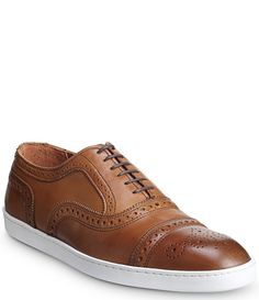 From Allen-Edmonds&#x2C; the Men's Strand Sneakers feature: Leather lined premium calfskin leather upperBuilt on the welted 65C LastFlyForm™ removable insole provides enhanced support and shock absorptionFlexible and comfortableLow profile durable rubber cup soleTheir best-selling Strand&#x2C; now available as a sneakerSix-eyelet lace-up oxford dress sneaker with brogue detailsDress casual style&#x2C; perfect any way you wear itRelaxed Fit&# Calf Leather Cap Toe Oxfords With Branded Insole, Business Sneakers In Calf Leather With Plain Toe, Business Casual Sneakers With Leather Sole, Leather Slip-on Sneakers For Business Casual, Slip-on Leather Sneakers For Business Casual, Leather Oxfords With Perforated Toe Box For Business, Low-top Calf Leather Oxfords For Business, Classic Brown Business Sneakers, Formal Leather Sneakers With Plain Toe