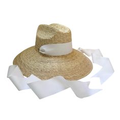 Our elegant take on the boho "lifeguard-style" surfer hat is woven with all-natural palm tree leaves. This sun hat ships woven with a long white grosgrain ribbon. This sun hat is one size fits most and features an elastic interior sweatband. Product Overview: Inner Crown Circumference: 22 inches (55.8 cm) Brim Length: 4.75 inches (12.5 cm) Crown Height: 5.5 inches (14 cm) We ship each order with a foam hat insert (also known as hat filler), that can be stuck behind the interior elastic, which ca White Toquilla Straw Hat Bands For Summer, White Toquilla Straw Hat Band For Summer, White Coastal Straw Hat For Vacation, White Coastal Style Straw Hat For Vacation, White Coastal Style Hat For Vacation, White Coastal Beach Hat, Vacation Sun Hat With Ribbon And Short Brim, Summer Straw Hat With Ribbon For Vacation, White Panama Hat With Flat Brim For The Beach