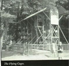 an old black and white photo of people standing in front of a building that is being built