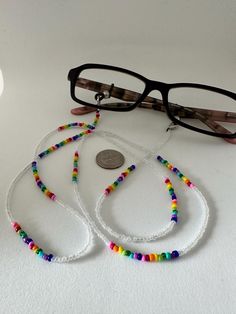 Rainbow Christmas Gift, Mother's Day 2024 Gift , Eyeglasses Chain Healing Crystal Beaded Sunglasses Chains with colorful beads for,Eyeglass Chain,Beaded Eye Glasses Strap Holders around Neck For Women Eyeglasses accessory Chain Healing Crystal Beaded Sunglasses Chains with Pearl for Women, Evil Eye Beads, Colorful, Quality Handmade, Mother's Day Gift, Gift for mom, Best Unique gift Welcome! Our products quality is the best.  You can buy our products as a gift for your friends, family or coworkers.  We create them with our passion.  Don't forget that your loyalty is our legacy. ITEM DETAILS: ✅Handmade ✅Vintage ✅Materials: yarn, bead HOW TO ORDER: ✅ Select the quantity. ✅ Click to Add to Cart. Sunglasses Chains, Beaded Eye, Beaded Glasses Chain, Beaded Glasses, Beaded Sunglasses, Eyeglasses Chain, Rainbow Christmas, Handmade Sunglasses, Eyeglass Accessories