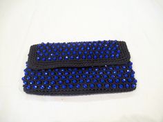 "This black fabric clutch with blue beads is by the Emporium and it snaps closed.  It measures 8-3/4\" wide and 5\" tall and was made in Italy.  The snap is coming loose, otherwise very nice.  From smoke free home." Blue Beaded Evening Bag For Formal Occasions, Blue Beaded Clutch Evening Bag, Rectangular Blue Beaded Clutch, Blue Handmade Clutch For Evening, Handmade Blue Clutch For Evening, Handmade Blue Evening Bag, Handmade Blue Clutch For Formal Occasions, Handmade Blue Clutch For Formal Events, Handmade Blue Evening Clutch