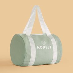 Our adorably sized Honest Duffel Bag lets you (or your mini!) stash + carry your Honest essentials to go in a sporty style! Large Capacity Sporty Travel Accessories For Everyday Use, Sporty Large Capacity Travel Accessories For Everyday Use, Sporty Travel Accessories With Large Capacity For Everyday Use, Sporty White Duffle Bag For Everyday Use, Sporty White Everyday Duffle Bag, Sporty Green Duffle Bag For Sports, Trendy Green Sports Bags, Sporty Green Everyday Bag, Green Sporty Bag For Daily Use