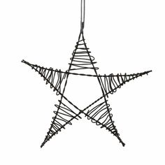 a wire star ornament hanging on a white background