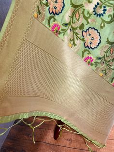 Paithani Style Floral Semi Banarasi Silk Dupatta. Meenakari Work with muted gold Zari Work. Handloom Dupatta, very light weight and soft. Item: DupattaBase color : Light Pista GreenFabric : Banarasi Semi Soft Silk (Not Pure Silk)Work : Weaved with tasselsLength of the Dupatta : 88 inches approx.Width of the dupatta : 34 1/2 inches (Approx.)Please note there are threads on the back side of the dupatta. Store Policies- No return or exchange will be accepted for color variations.- No return or exch Pista Green Anarkali Saree Set For Festivals, Pista Green Cutdana Dupatta, Traditional Festive Pista Green Anarkali Set, Green Meenakari Sharara, Traditional Pista Green Anarkali Set For Festivals, Traditional Festive Pista Green Sharara, Green Dupatta With Zari Work, Pista Green Traditional Anarkali Set With Dupatta, Pista Green Cutdana Traditional Wear For Navratri