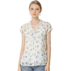 Lightweight and breezy, the shirt is perfect for sunshine styling. A floral print updates this top, perfect for adding a summer pattern to warm-weather looks. Made of a lightweight fabric, the printed style has a self-tie decor at the neckline and a ruffled trim. It has a loose fit that falls to the hip, so you can easily tuck it into skirts or jeans. Breezy V-neck Summer Top, Breezy Summer Blouse With Ruffles, Summer Breezy Blouse With Ruffles, Feminine Summer Blouse For Beach, Breezy Flowy Spring Top, Breezy Flowy Top For Spring, Flowy Tops For Spring Season, Feminine Summer Beach Blouse, Summer V-neck Shirt With Floral Print