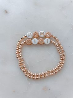 Angela Holm X Just Bead it by Rachel Treat yourself and your mini to the perfect accessory duo: Mama and Mini Neutral Bracelets! Whether you're rockin' a tan and white combo, complete with gold letter beads, or go for a classic 14k gold filled look – these one-of-a-kind bracelets from Angela Holm X Just Bead it by Rachel are exactly what you and your little one need to make a fashion statement any day of the week! This set comes with one Mama Bracelet and you can chose how many mini bracelets yo Mama Mini Bracelet, Diy Mama Bracelet, Mama And Me Bracelets, Mama Bracelet Beads, Mama And Mini Bracelets, Everyday Rose Gold Beaded Bracelets With Letter Beads, Dainty Adjustable Stretch Bracelet With Letter Beads, Adjustable Rose Gold Beaded Bracelet, Adjustable Rose Gold Beaded Bracelet With Letter Beads