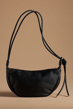 The Mali + Lili Convertible Sling Bag is crafted from polyurethane with a polyester lining. It features two inner slip pockets and one inner zip pocket. This bag can be worn as a cross body bag or a shoulder bag. It has an adjustable strap and a zipper closure. Everyday Waterproof Bag, Large Sling Bag, Cute Everyday Bags, 2025 Purse Trends, 2024 Purse Trends, 2024 Bag Trends, Best Crossbody Bag Travel, Trendy Designer Bags, Leather Sling Bags Women