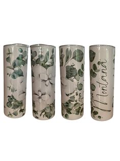 four glass cups with floral designs on them