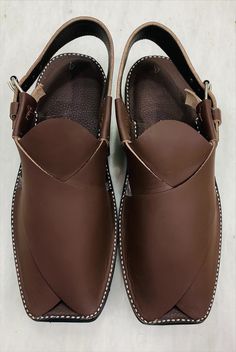 *Elevate your style with our exquisite Dark Brown handmade leather Peshawari shoes. Crafted with precision and care, this footwear is a testament to fine craftsmanship. Handmade from genuine, high-quality leather, this Peshawari footwear offer a perfect blend of comfort and elegance. *The deep, rich brown hue adds a touch of sophistication to any outfit, making them versatile for both casual and formal occasions. Each pair is created with attention to detail, ensuring durability and longevity. T Leather Sandals With Dabka And Round Toe, Traditional Formal Leather Shoes With Rubber Sole, Traditional Plain Toe Leather Shoes, Traditional Leather Open Toe Shoes, Traditional Closed Toe Sandals With Leather Lining, Artisan Closed Toe Leather Shoes, Artisan Leather Closed Toe Shoes, Traditional Brown Leather Shoes With Leather Footbed, Traditional Brown Leather Shoes With Stitched Sole