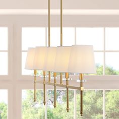 At just over three-feet long, this linear pendant is perfectly sized to hang over a kitchen island or dining room table. The simple, elegant frame features lucite accents; the five warm LED bulbs are softened by ivory linen shades. This versatile linear pendant is ideal for modern, minimalist dining rooms as well as traditional spaces. JONATHAN Y Sophie 38.5" Iron Mid-Century 5-Light Brass Gold Modern/Contemporary Linear LED Large Hanging Kitchen Island Light | JYL9919A Rectangle Chandelier Over Kitchen Island, Island Linear Lighting, Dining Room Light Fixtures Over Table, Hallway Paneling, Linear Chandelier Dining Room, Dining Lights, Kitchen 2021, Kitchen Island Light, Floor Office