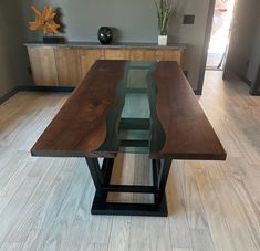 a wooden table sitting on top of a hard wood floor