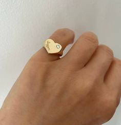 This beautiful signet ring features a heart with a single stone and engraving of your choice. 14K Yellow, White or Rose Gold Script engraving 8mm or 10mm heart FINAL SALE Heart Signet Ring, Single Stone, Special Cards, Gift Card Sale, Personalized Necklace, Signet Ring, Diamond Studs, A Heart, Personalized Custom