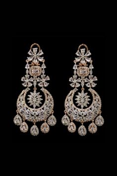 Fadia Kundan Earrings With their stunning cascading silhouette these pair of earrings will inject an extra dose of glamour to your look.  Exquisite chandelier earrings with high-quality CZ stones Approximately earrings size is 4.25 .  Silver-plated on high-quality brass as the base metal. Details: Handcrafted Metal: Silver Plated Stone: CZ stones Dimensions: Length 4.25 inches  Chandelier Earrings Wedding Statement Earrings, Wedding Earrings Chandelier, Statement Earrings Wedding, Bridal Statement Earrings, Bridesmaid Gifts Earrings, Bridal Earrings Chandelier, Kundan Jewellery Set, Silver Chandelier Earrings, Long Silver Earrings