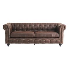 a brown leather couch sitting on top of a white floor