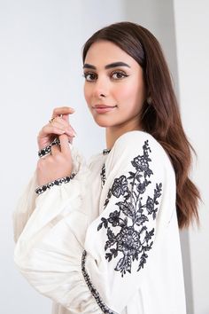 Original Maria B Brand new without tags Description Adding ethereal allure to your everyday look with our embroidered arabic lawn dress adorning the heavenly white canvas with floral embroideries. Details: Dyed shirt, Embroidered Scoop Neckline, Full Sleeves With Embroidery & Motif Detailing Colour: White Fabric: Arabic Lawn Note: Only Dry Clean Model is wearing size xs Disclaimer: Product Color May Vary Slightly Due To Photographic Lighting Or Your Device Settings. Cotton Kurta With Embroidered Cuffs, Cotton Kurta With Embroidered Cuffs Long Sleeve, Spring Long Sleeve Kurta With Embroidered Cuffs, Spring Kurta With Embroidered Cuffs And Long Sleeves, White Embroidered Unstitched Kurta, White Kurta With Embroidered Sleeves, Eid White Kurta With Embroidered Sleeves, Eid Long Sleeve Blouse With Embroidered Sleeves, Spring Kurta With Embroidered Sleeves Tunic