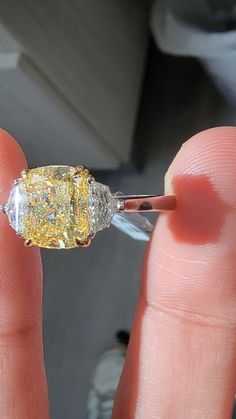 As much as all yellow diamonds want to look like the sun- this one really does. Absolutely dripping with color, no patches of emptiness in the stone; completely vibrant and beautiful Set in Platinum and 18kt Yellow Gold with 0.58ct of Epaulettes Yellow Oval Brilliant Cut Diamond Ring, Dazzling Yellow Oval Ring, Dazzling Brilliant Cut Yellow Diamond Ring, Dazzling Yellow Brilliant Cut Diamond Ring, Dazzling Oval Yellow Ring, Dazzling Yellow Diamond Ring With Center Stone, Yellow Diamond Ring With Center Stone, Fine Jewelry Yellow Diamond Ring With Center Stone, Yellow Cushion Cut Diamond Ring With Center Stone