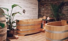 two wooden tubs sitting on top of a wooden floor