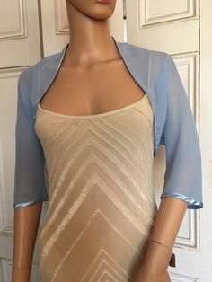 This is a beautiful hand made light blue shrug ideal for weddings or special occasions. It can also be worn with casual wear. It can be made in any size from 8 to 24 (UK sizes). It is made in the UK. It is normally sent out to you within 5 days, but I am very happy to make your order a priority if you need it urgently. Just let me know the date needed by. Postage is free in the UK! International postage is £9. I am happy to exchange items or refund your payment if you are less than happy with th Fitted Blue Shrug For Spring, Elegant Fitted Summer Shrug, Elegant Stretch Shrug For Spring, Spring Formal Fitted Shrug, Elegant Stretch Open Front Shrug, Elegant Fitted Shrug With Open Front, Fitted Open Front Shrug For Party, Elegant Fitted Open Front Shrug, Blue Shrug