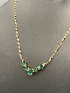 "This beautiful ladies 14 karat gold emerald and diamond necklace was designed and made in 14 karat solid yellow gold.  The central focus of the necklace is a graduated row of 5 natural oval emeralds and 8 fine white quality round diamonds prong set in between.  Finishing this beautiful necklace is a 14 karat gold Copenhagen chain secured a lobster claw lock.  Gorgeous on a woman's neck!! Weight-7.4 grams Length-16 ⅝\" Emeralds:1.75cts TDW: 0.33 cts Our Price $750.00 Regularly Priced At $1100.00 Please See Our Video  Remember - whether you're purchasing for yourself or a gift for a loved one, Buy With Confidence!  We Guarantee Everything We Sell!  SKU # N679" Gold Coin Jewelry, Amethyst Bangle, Claw Necklace, Sapphire And Diamond Earrings, Vintage Sapphire, Coin Jewelry, Wedding Jewellery Necklace, Emerald Diamond, Gorgeous Earrings