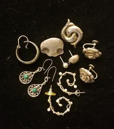 "This lot includes three pair of wearable earrings and five single earrings.   Included in this lot: ~ 3/4\" vintage Sterling Danecraft screw-on rose design earrings ~ 3/4\" vintage unmarked silver filigree pierced earrings with green stones.  ~ 1\" artisan pearl and wire silver tone earrings. ~ 5 single earrings including an MMA (Museum of Modern Art) dolphin design, a MEXICO earring, and a wavy earring engraved \"Sterling Cathryn\". Even though this lot is all in very good condition, please un Vintage Single Earring For Everyday, Vintage Single Earring For Everyday Wear, Sterling Silver Clip-on Earrings For Everyday, Sterling Silver Clip-on Earrings Set For Everyday, Vintage Everyday Earrings With Ear Wire, Vintage Pierced Jewelry For Everyday, Vintage Everyday Pierced Jewelry, Vintage Everyday Jewelry, Nickel-free Silver Costume Jewelry Earrings