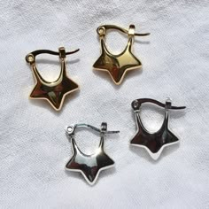 These star-shaped hoop earrings are made from silver/gold plated stainless steel and are safe for exposure to sweat and water without the threat of tarnishing.Length: ~0.75"Width: ~0.6" Star Hoop Earrings, Preppy Jewelry, Chunky Earrings, Funky Jewelry, Jewelry Lookbook, Earrings In Gold, Heart Locket, Jewelry Inspo, Dream Jewelry