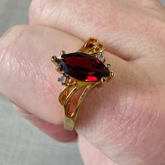 This Pretty Ring Appears To Be In It's Original Box. Labelled Made In Thailand, 14kt Two Tone. Not Sure What The Two-Tone Means. The Diamonds Test Positive. The Gold Is Not Tested. Beautiful Red Marquis Garnet, Flanked By Two Small Round Diamonds. Beautiful Gold Finish, In Excellent Condition. From A High End Estate Garnet And Diamond Ring, Pretty Ring, Pretty Rings, Types Of Rings, Mozambique, Pendant Earrings, Womens Jewelry Rings, Bracelet Gift, Red Gold