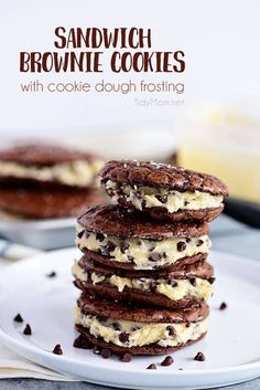 chocolate sandwich cookies with cookie dough frosting on a white plate